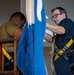 Sailors Hang Flags Aboard USS Carl Vinson (CVN 70)