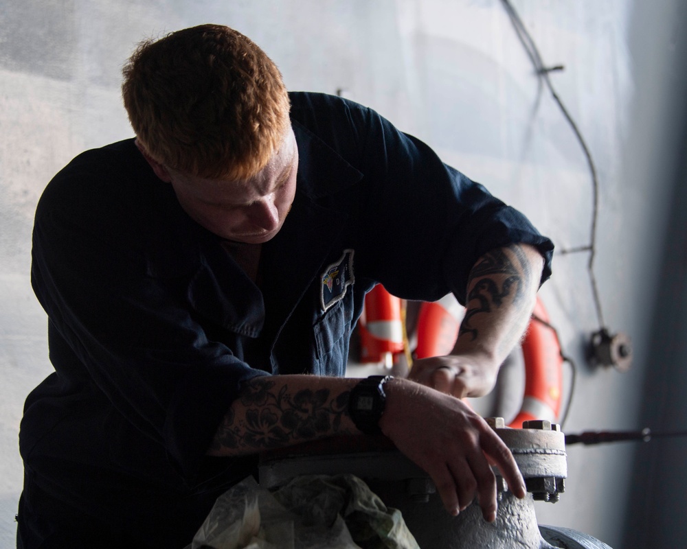 Sailor Shines Brass Aboard USS Carl Vinson (CVN 70)