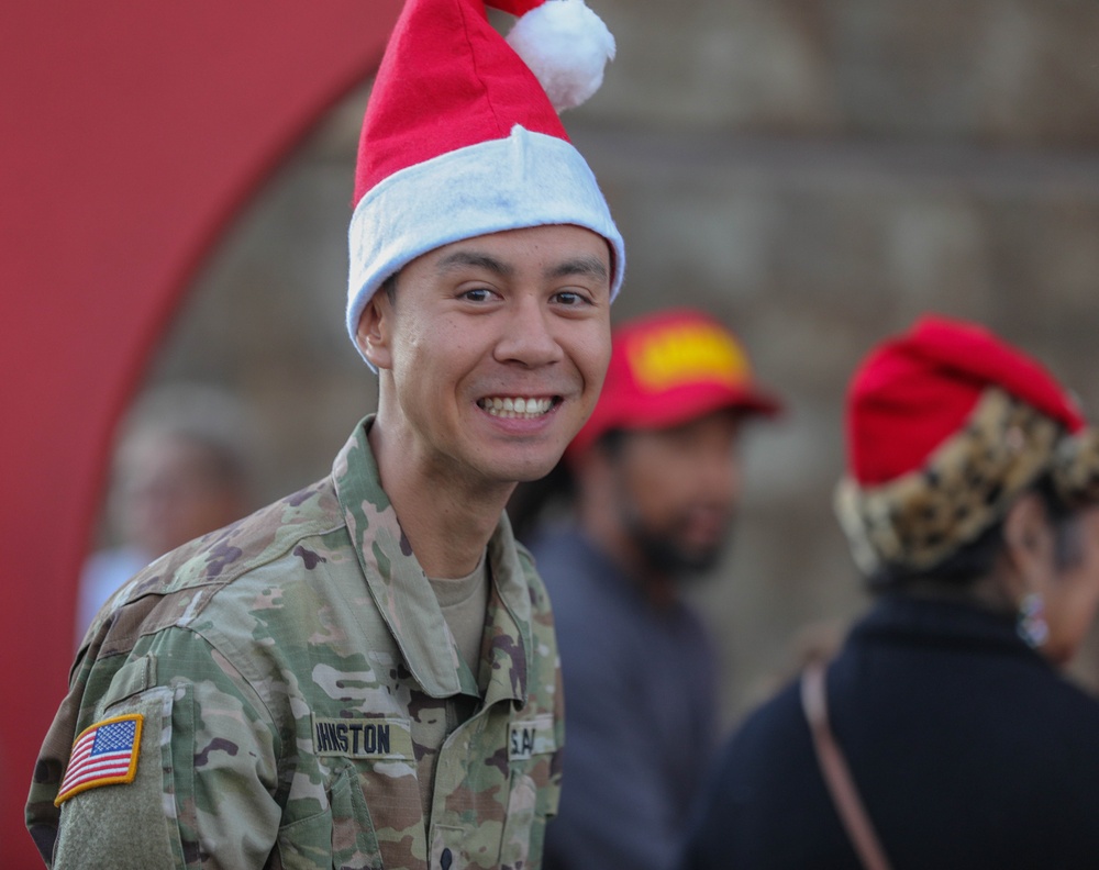 Service members take children shopping for &quot;Heroes and Helpers&quot; holiday event