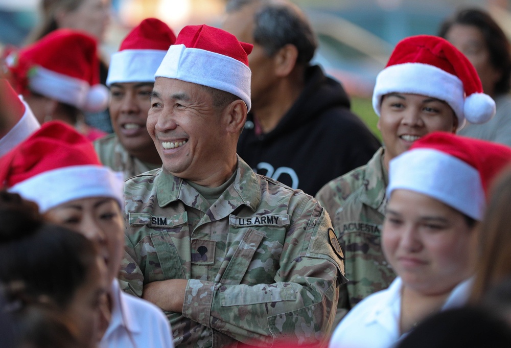 Service members take children shopping for &quot;Heroes and Helpers&quot; holiday event
