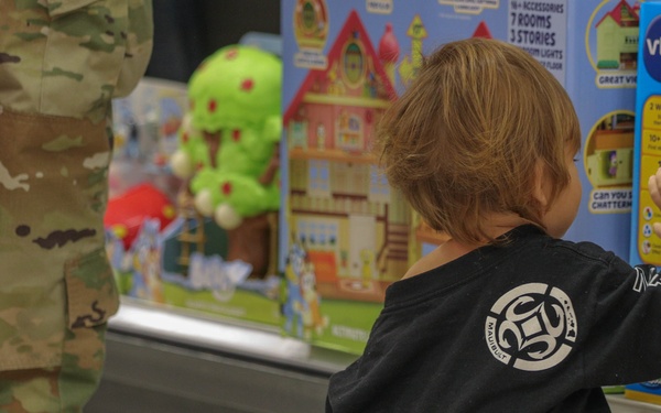 Service members take children shopping for "Heroes and Helpers" holiday event