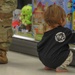 Service members take children shopping for &quot;Heroes and Helpers&quot; holiday event