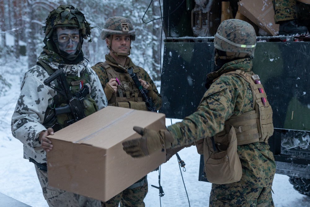 Freezing Winds 23: Marines With CLB-6 Resupply Finnish Service Members of The Nylands Brigade