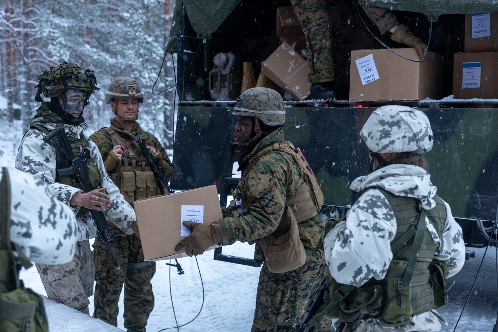 Freezing Winds 23: Marines With CLB-6 Resupply Finnish Service Members of The Nylands Brigade