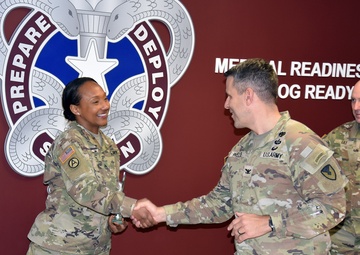 COL Welde congratulates SSG Kemp