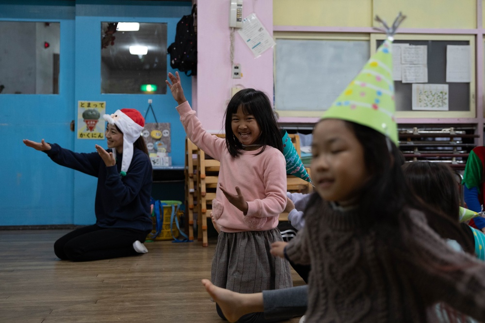 Holiday cheer: Volunteers from Marine Corps Air Station Iwakuni visit Higashi Nursery
