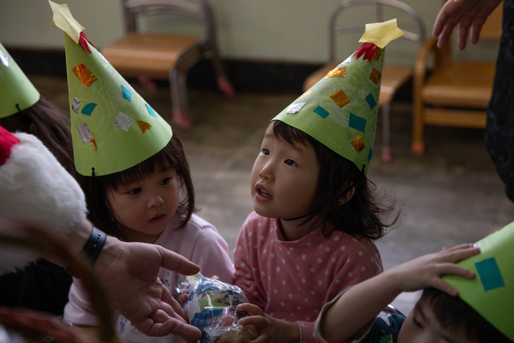 Holiday cheer: Volunteers from Marine Corps Air Station Iwakuni visit Higashi Nursery