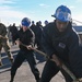 U.S Sailors and Marines handle line aboard USS New York (LPD-21)