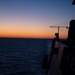 The Sun rises in the wake of USS New York (LPD-21)