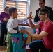 Paratroopers from Task Force 82 present gifts to children during Operation Angel Tree