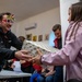 Paratroopers from Task Force 82 present gifts to children during Operation Angel Tree