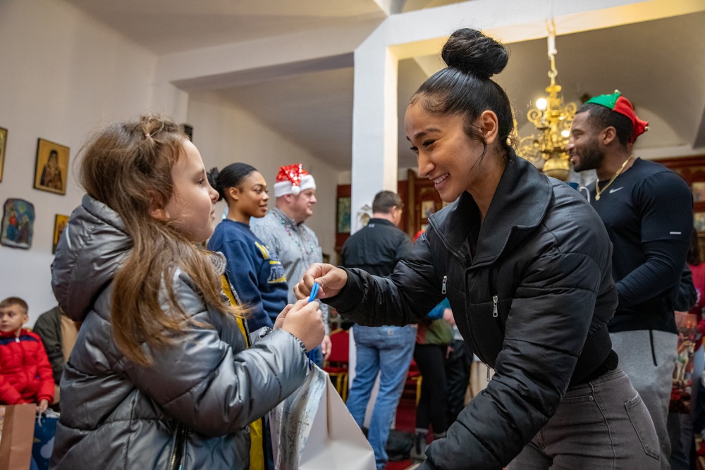 Paratroopers from Task Force 82 present gifts to children during Operation Angel Tree