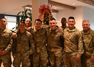 Members from the 272nd Engineering Installation Squadron receive token of appreciation