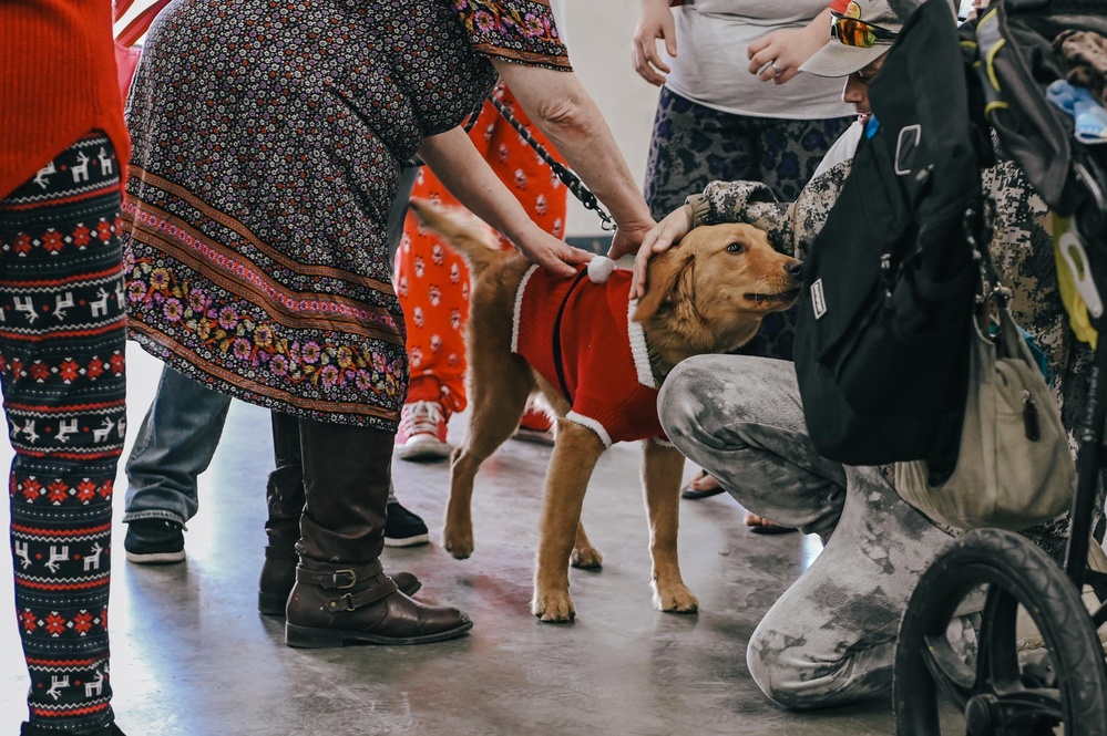 139th members volunteer at a Christmas party for Specialty Industries