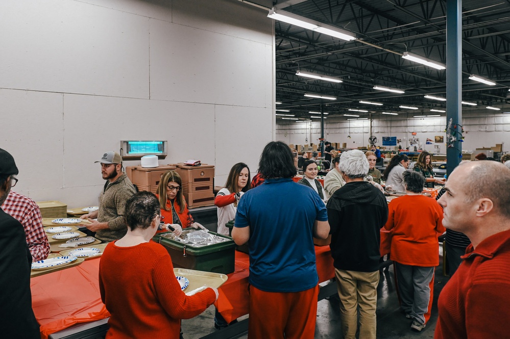 139th members volunteer at a Christmas party for Specialty Industries