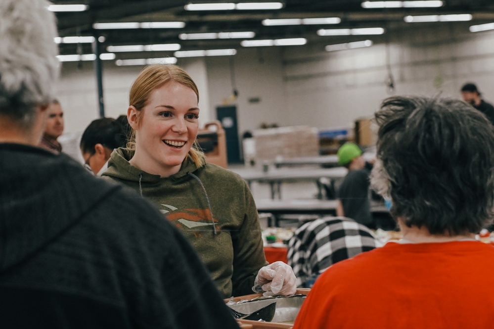 139th members volunteer at a Christmas party for Specialty Industries