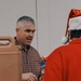 139th members volunteer at a Christmas party for Specialty Industries