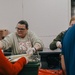 139th members volunteer at a Christmas party for Specialty Industries