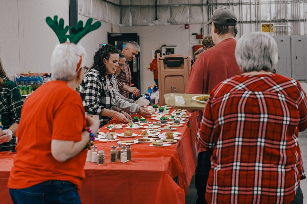 139th members volunteer at a Christmas party for Specialty Industries