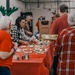 139th members volunteer at a Christmas party for Specialty Industries