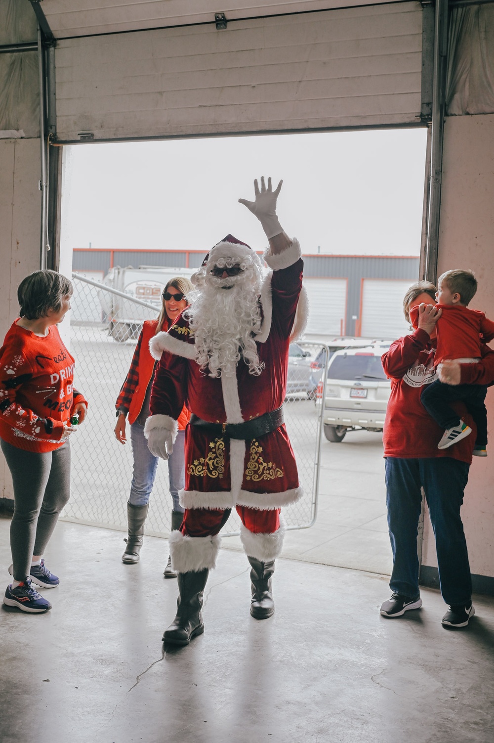 139th members volunteer at a Christmas party for Specialty Industries