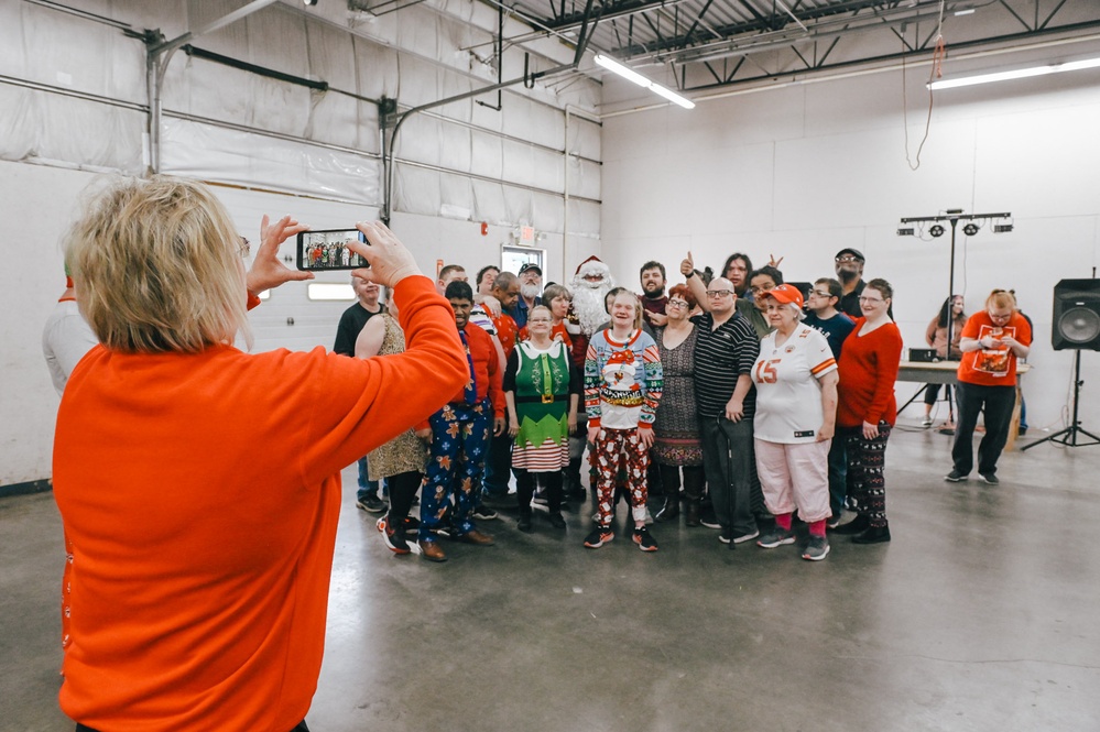 139th members volunteer at a Christmas party for Specialty Industries