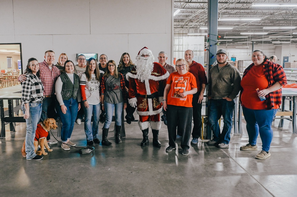 139th members volunteer at a Christmas party for Specialty Industries