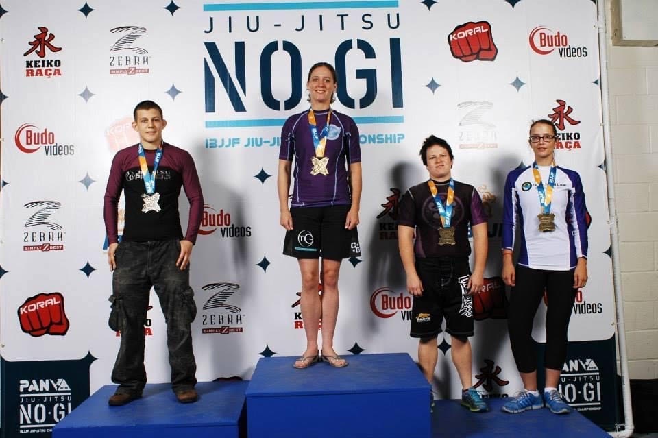 Master Sgt. Megan Lomonof stands on the top podium during one of her 12 International Brazilian Jiu Jitsu Federation gold medal wins. (Courtesy photo)
