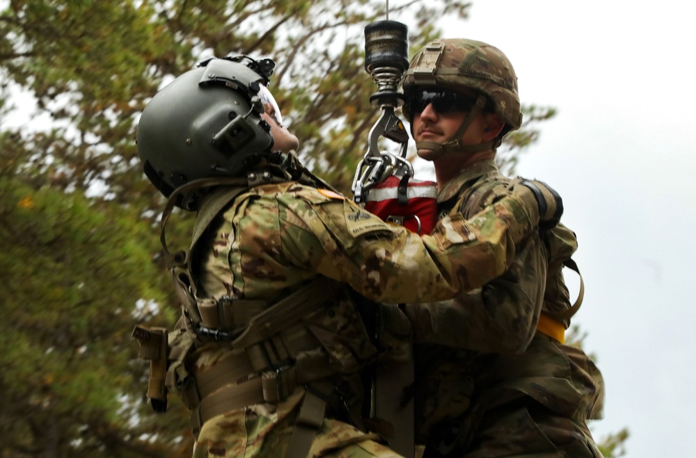 Black Hawk helicopter crew chiefs 1st-171st General Support Aviation Battalion, 57th Troop Command conduct medical evacuation drills for predeployment training