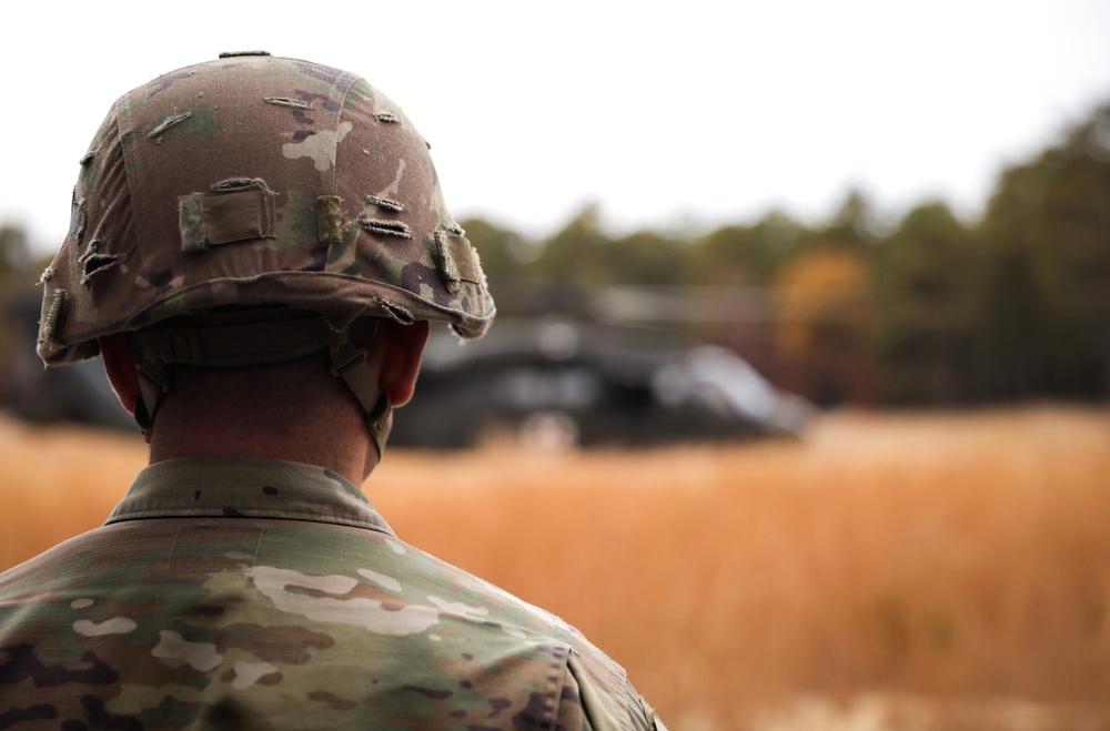 Black Hawk helicopter crew chiefs 1st-171st General Support Aviation Battalion, 57th Troop Command conduct medical evacuation drills for predeployment training