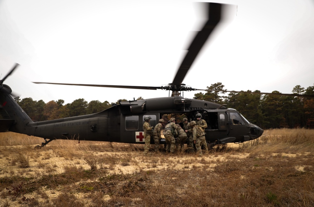 Black Hawk helicopter crew chiefs 1st-171st General Support Aviation Battalion, 57th Troop Command conduct medical evacuation drills for predeployment training