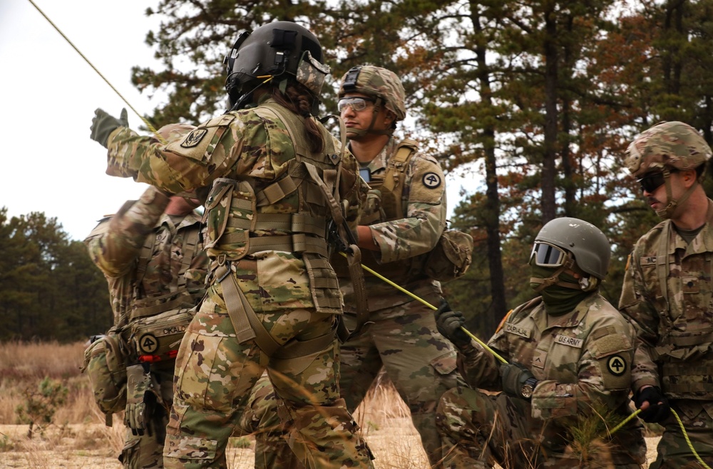 Black Hawk helicopter crew chiefs 1st-171st General Support Aviation Battalion, 57th Troop Command conduct medical evacuation drills for predeployment training