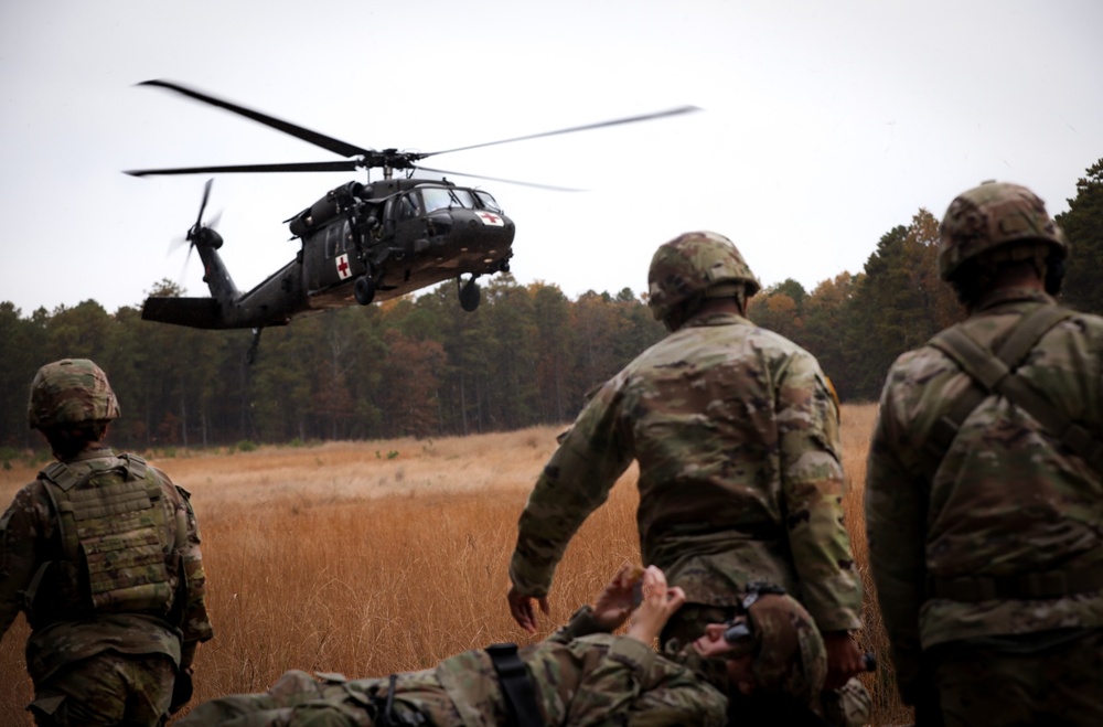 Black Hawk helicopter crew chiefs 1st-171st General Support Aviation Battalion, 57th Troop Command conduct medical evacuation drills for predeployment training