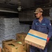 USS Ronald Reagan (CVN 76) Sailors move produce into storage