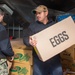 USS Ronald Reagan (CVN 76) Sailors move produce into storage