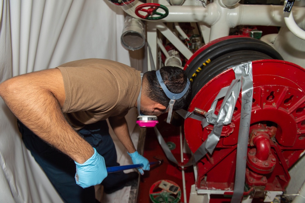 USS Ronald Reagan (CVN 76) Sailors perform maintenance and corrosion control