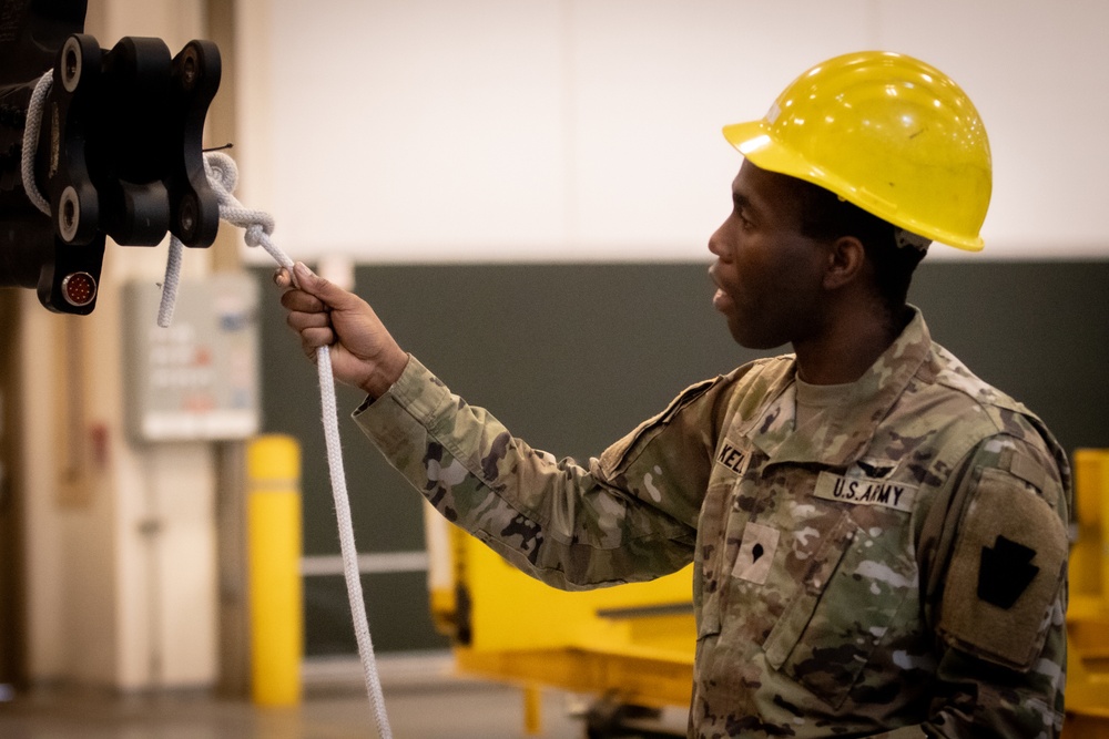 National Guard Helicopter Crew Chiefs conduct Maintenance on Black Hawk Helicopters