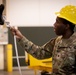 National Guard Helicopter Crew Chiefs conduct Maintenance on Black Hawk Helicopters