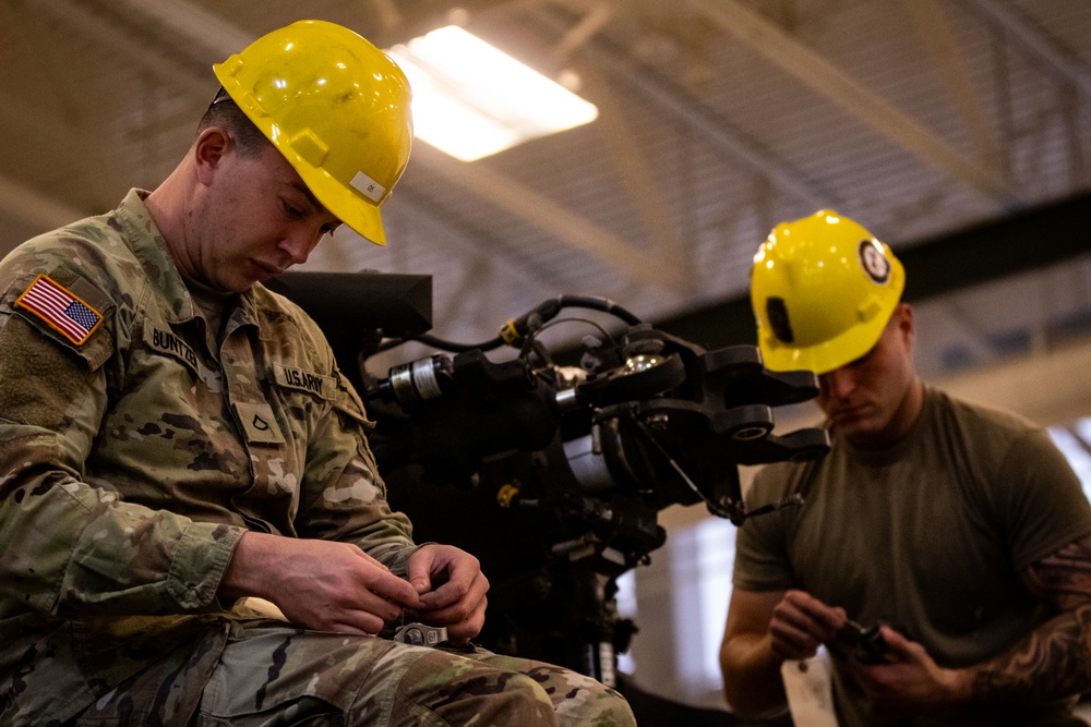 National Guard Helicopter Crew Chiefs conduct Maintenance on Black Hawk Helicopters