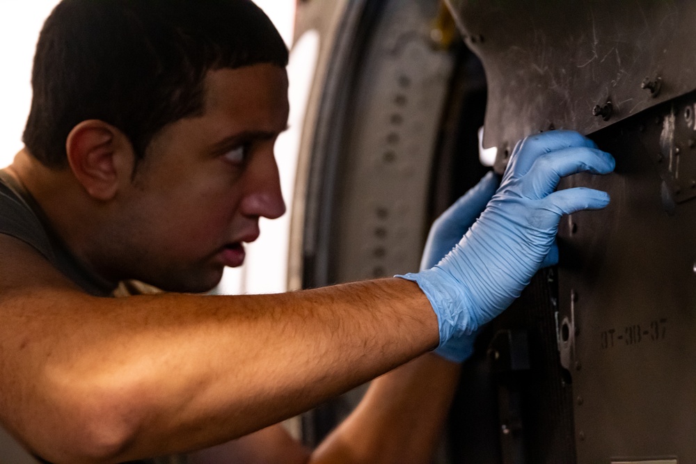 National Guard Helicopter Crew Chiefs conduct Maintenance on Black Hawk Helicopters