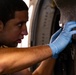 National Guard Helicopter Crew Chiefs conduct Maintenance on Black Hawk Helicopters