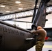 National Guard Helicopter Crew Chiefs conduct Maintenance on Black Hawk Helicopters