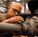 National Guard Helicopter Crew Chiefs conduct Maintenance on Black Hawk Helicopters