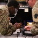 National Guard Helicopter Crew Chiefs conduct Maintenance on Black Hawk Helicopters