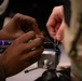 National Guard Helicopter Crew Chiefs conduct Maitenance on Black Hawk Helicopters