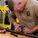 National Guard Helicopter Crew Chiefs conduct Maintenance on Black Hawk Helicopters