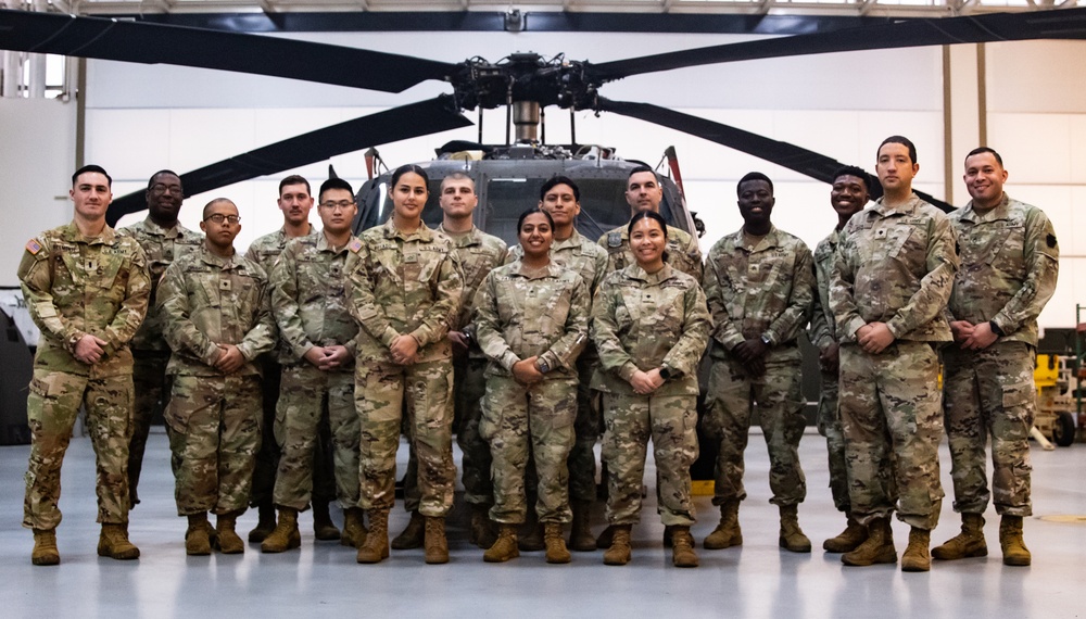 National Guard Helicopter Crew Chiefs conduct Maintenance on Black Hawk Helicopters