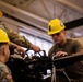 National Guard Helicopter Crew Chiefs conduct Maintenance on Black Hawk Helicopters