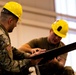 National Guard Helicopter Crew Chiefs conduct Maitenance on Black Hawk Helicopters