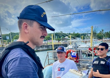 U.S. Coast Guard aids stranded vessel Rascal off Tanguisson Beach, Guam, on Christmas weekend